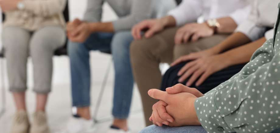 People at group therapy session indoors, closeup