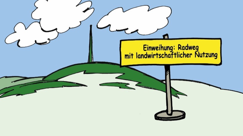 Im Vordergrund ein Schild mit Hinweis zur Einweihung, im Hintergrund der Donnersberg