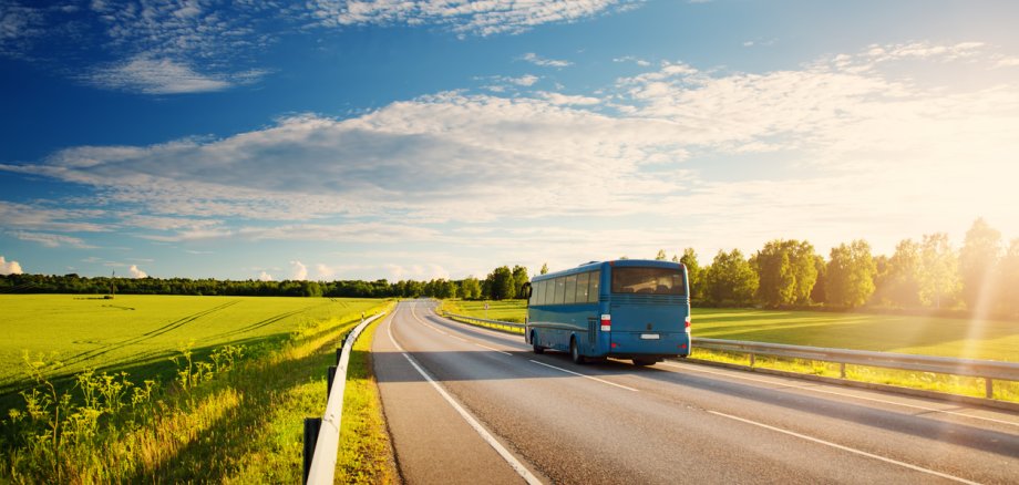 Bus on asphalt road in beautiful spring day Bus on asphalt road in beautiful spring day